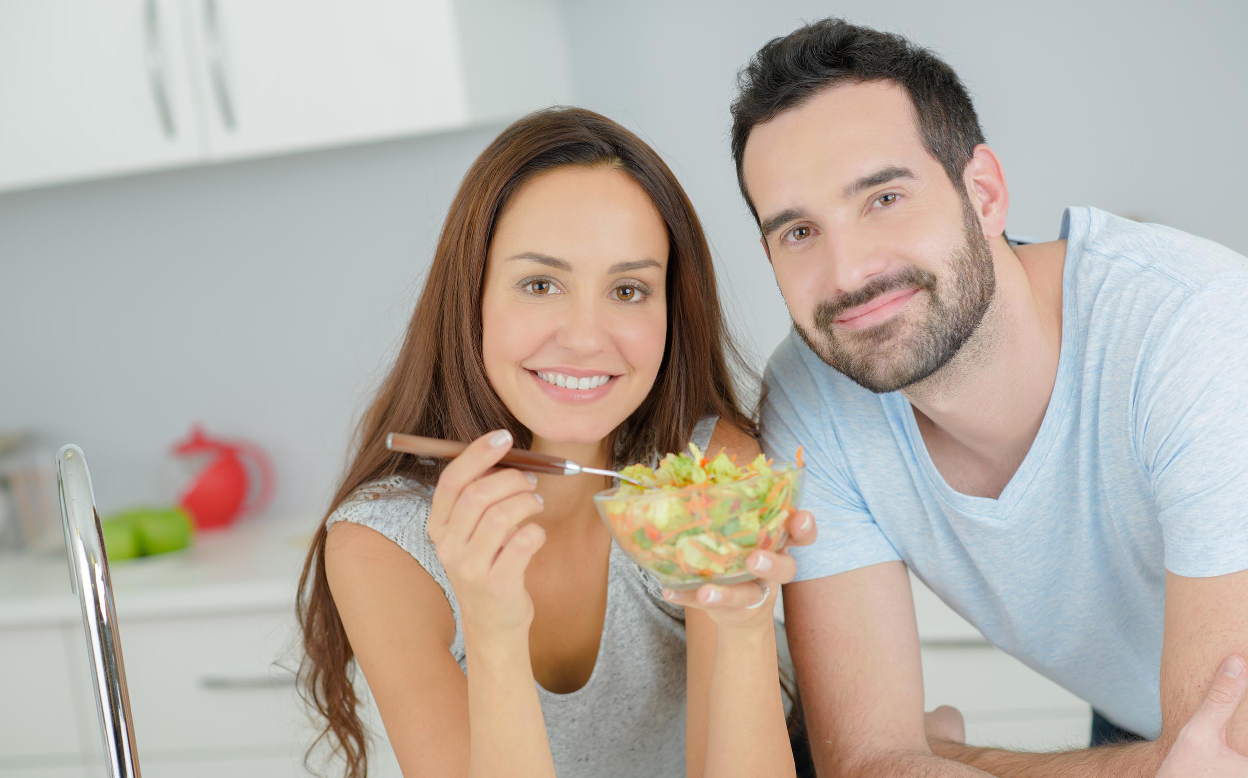 Couple eating healthy salad